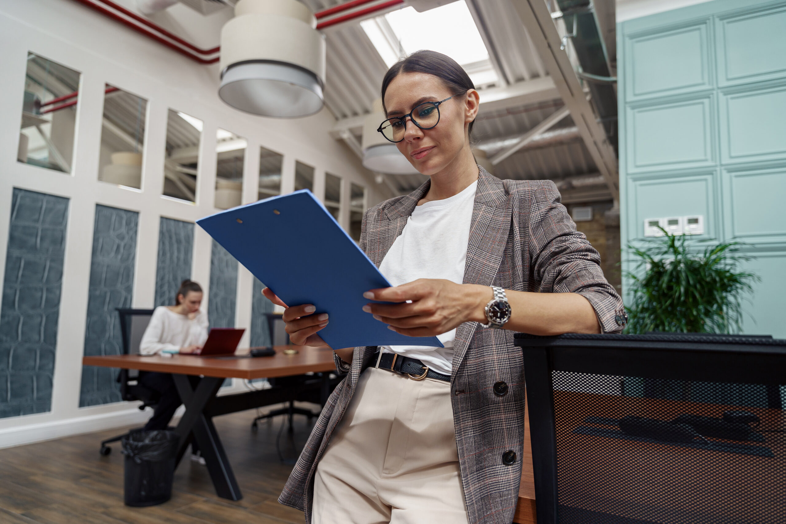 portrait of smiling businesswoman with documents s 2023 11 27 04 59 08 utc scaled